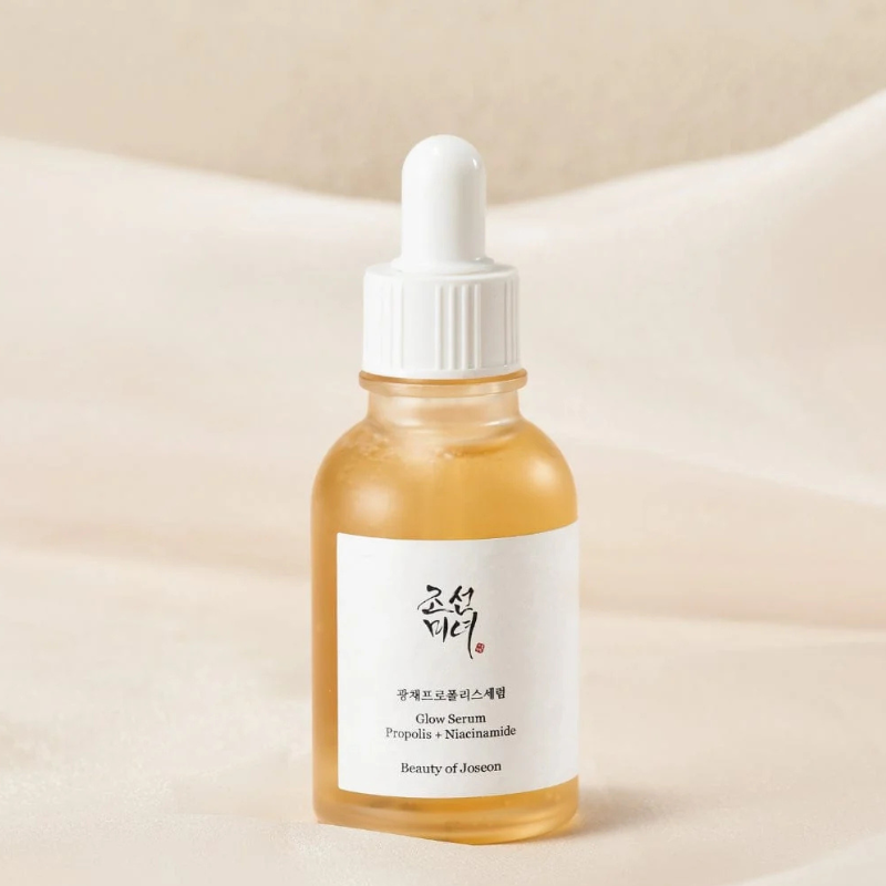 Beauty of Joseon Glow Serum with Propolis and Niacinamide in a glass dropper bottle on a soft background.